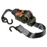 A Monkey Grip retractable ratchet tie down system with black webbing, a rubber handle ratchet mechanism, and metal hooks.