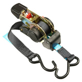 A Monkey Grip retractable ratchet tie down system with black webbing, a rubber handle ratchet mechanism, and metal hooks.